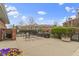 Community patio area offers seating, grilling, and outdoor enjoyment with meticulously kept landscaping at 8651 Jaffa Court East Dr # 18, Indianapolis, IN 46260