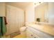Bathroom featuring a vanity, shower with curtain and honeycomb tile flooring at 9143 Warwick Rd, Indianapolis, IN 46240