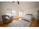 Bright bedroom with vaulted ceiling, hardwood floors, and large windows at 9143 Warwick Rd, Indianapolis, IN 46240