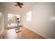 Bright bedroom featuring laminate floors, slider to patio, and natural light at 9143 Warwick Rd, Indianapolis, IN 46240