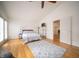 Spacious bedroom with hardwood floors, large windows, and a cozy rug at 9143 Warwick Rd, Indianapolis, IN 46240