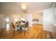 Open dining area flows into the kitchen with hardwood floors and plenty of natural light at 9143 Warwick Rd, Indianapolis, IN 46240