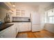 Bright kitchen with white cabinets, stainless appliances, and subway tile backsplash at 9143 Warwick Rd, Indianapolis, IN 46240