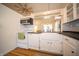 Bright kitchen boasts a farmhouse sink, stainless appliances, and modern backsplash at 9143 Warwick Rd, Indianapolis, IN 46240
