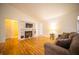 Cozy living room with a fireplace, built-in shelving, and a comfortable couch at 9143 Warwick Rd, Indianapolis, IN 46240