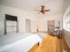 A spacious main bedroom featuring vaulted ceilings and hardwood flooring at 9143 Warwick Rd, Indianapolis, IN 46240