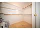 A walk-in closet with built-in shelving and a neutral carpet at 9143 Warwick Rd, Indianapolis, IN 46240
