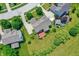Expansive aerial view of a home with a large yard, mature trees, and a deck for outdoor enjoyment at 9318 Windrift Way, Zionsville, IN 46077
