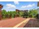 Large wooden deck with pergola and built in benches overlooks a private backyard with lush greenery at 9318 Windrift Way, Zionsville, IN 46077