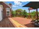 Spacious wooden deck with a pergola, ideal for outdoor dining and relaxation with backyard views at 9318 Windrift Way, Zionsville, IN 46077