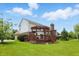 Two-story home with a large backyard, wood deck and mature trees provide a peaceful outdoor space at 9318 Windrift Way, Zionsville, IN 46077