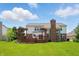 Spacious backyard featuring a wooden deck with pergola, perfect for outdoor entertaining and relaxation at 9318 Windrift Way, Zionsville, IN 46077