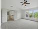 Large bedroom with staircase and big windows offering plenty of natural light and great views at 9318 Windrift Way, Zionsville, IN 46077