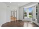 Bright empty room with tile flooring, neutral walls, and natural light from a bay window at 9318 Windrift Way, Zionsville, IN 46077