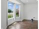 Bright empty room featuring tile flooring, natural light from a large window, and neutral wall color at 9318 Windrift Way, Zionsville, IN 46077