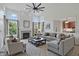 Well-appointed living room with a fireplace, neutral decor, and comfortable seating at 9318 Windrift Way, Zionsville, IN 46077