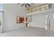 Open living space with a view to the upstairs and a glimpse into the kitchen at 9318 Windrift Way, Zionsville, IN 46077