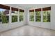 Sunroom with multiple windows providing ample natural light and scenic views at 9318 Windrift Way, Zionsville, IN 46077