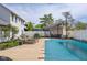 Inviting backyard featuring a covered pool, outdoor seating, and a charming cabana at 933 Hummingbird Ln, Columbus, IN 47203