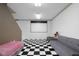 Spacious basement area featuring a black and white tile floor and ample room for entertainment at 933 Hummingbird Ln, Columbus, IN 47203
