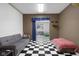 Finished basement showcasing versatile space with checkerboard flooring at 933 Hummingbird Ln, Columbus, IN 47203
