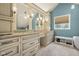 A spacious bathroom featuring an extended vanity, neutral paint, granite counters, tile floor and a freestanding bathtub at 933 Hummingbird Ln, Columbus, IN 47203