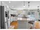 Bright, open kitchen with white cabinetry, stainless steel appliances, and a center island with seating at 933 Hummingbird Ln, Columbus, IN 47203