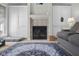 Living room showcasing a fireplace flanked by built-in cabinets and a decorative rug, creating a warm atmosphere at 933 Hummingbird Ln, Columbus, IN 47203