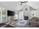 Inviting living room with a fireplace, built-in cabinets, large windows, and a cozy seating arrangement at 933 Hummingbird Ln, Columbus, IN 47203