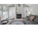Bright living room featuring a fireplace, built-in cabinets, and a comfortable sofa with decorative pillows at 933 Hummingbird Ln, Columbus, IN 47203