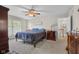 Serene main bedroom with a comfortable bed, natural light, and views of the outdoors at 933 Hummingbird Ln, Columbus, IN 47203