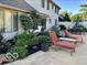 Comfortable patio featuring outdoor lounge chairs and well-maintained landscaping at 933 Hummingbird Ln, Columbus, IN 47203