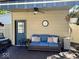 Cozy patio with comfortable seating, ceiling fan, and charming decor at 933 Hummingbird Ln, Columbus, IN 47203