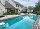 Backyard pool with a diving board and lounge chairs at 933 Hummingbird Ln, Columbus, IN 47203