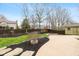 Landscaped backyard featuring a shed and an outdoor patio at 950 Nevelle Ln, Carmel, IN 46032