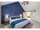 Stylish bedroom featuring a vaulted ceiling, barn door, and complementary colors at 950 Nevelle Ln, Carmel, IN 46032