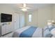 Bright bedroom featuring a large window and closet at 950 Nevelle Ln, Carmel, IN 46032