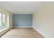 Bright bedroom with hardwood floors and large window at 950 Nevelle Ln, Carmel, IN 46032