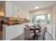 Bright breakfast nook with a bay window and a view of the backyard at 950 Nevelle Ln, Carmel, IN 46032