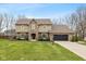 Charming two-story home with a well-manicured lawn and a two-car garage at 950 Nevelle Ln, Carmel, IN 46032