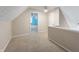 Attic space with neutral walls and carpet flooring with access to additional rooms at 961 Parkside Dr, Columbus, IN 47203
