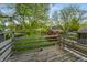 View from balcony shows greenery and a glimpse of a neighboring pool and homes at 961 Parkside Dr, Columbus, IN 47203