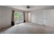 Bedroom with carpet, ceiling fan and french doors leading to a balcony; ensuite bathroom at 961 Parkside Dr, Columbus, IN 47203