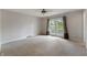 Bedroom with carpet, ceiling fan and french doors leading to a balcony at 961 Parkside Dr, Columbus, IN 47203