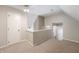 Upper hallway features carpet, door to a closet and view of stairs to first floor at 961 Parkside Dr, Columbus, IN 47203