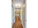 Hallway with hard wood flooring, neutral walls, and access to other rooms at 961 Parkside Dr, Columbus, IN 47203