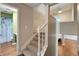 Carpeted stairs leading to the second story with a bathroom and living area at 961 Parkside Dr, Columbus, IN 47203