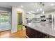 Modern kitchen with granite island, stainless steel appliances and custom cabinetry at 961 Parkside Dr, Columbus, IN 47203