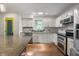 Updated kitchen featuring granite countertops, stainless steel appliances, and custom cabinetry at 961 Parkside Dr, Columbus, IN 47203