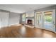 Inviting living room with fireplace, hardwood floors, and access to screened-in porch for indoor-outdoor living at 961 Parkside Dr, Columbus, IN 47203